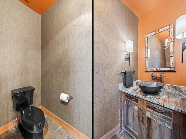 66 Elk Highlands Dr, Whitefish, MT 59937 - bathroom featuring baseboards, vanity, and toilet