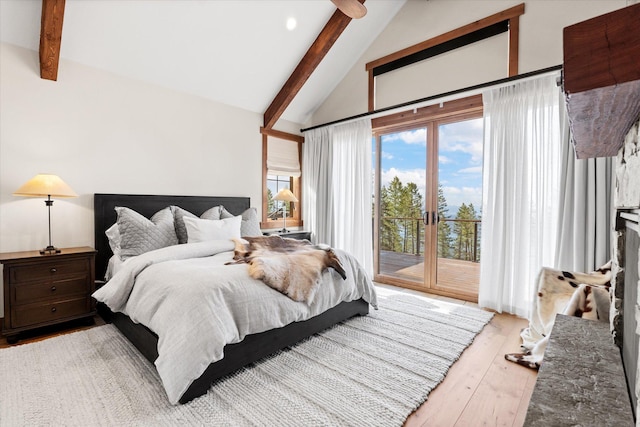 66 Elk Highlands Dr, Whitefish, MT 59937 - bedroom featuring beamed ceiling, access to outside, light wood finished floors, and high vaulted ceiling