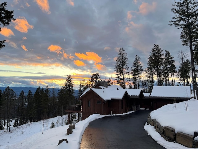 66 Elk Highlands Dr, Whitefish, MT 59937 - snow covered property featuring board and batten siding