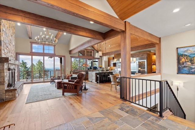 66 Elk Highlands Dr, Whitefish, MT 59937 - living area featuring a chandelier, light wood-style flooring, a fireplace, recessed lighting, and wine cooler