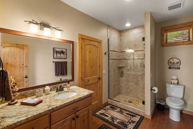 51605 Lake Mary Ronan Rd, Proctor, MT 59929 - full bathroom with vanity, a stall shower, wood tiled floors, and recessed lighting