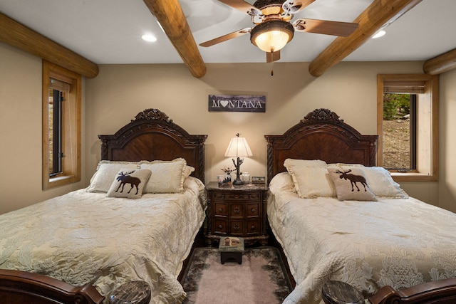 51605 Lake Mary Ronan Rd, Proctor, MT 59929 - carpeted bedroom featuring beam ceiling, recessed lighting, and ceiling fan