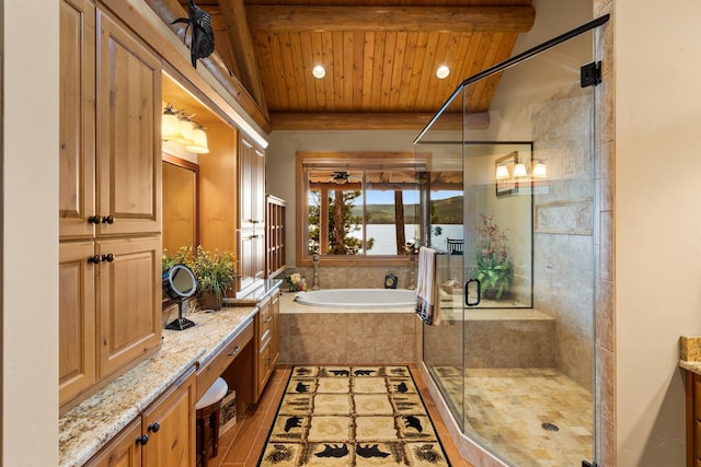 51605 Lake Mary Ronan Rd, Proctor, MT 59929 - bathroom with a wood ceiling with exposed beams, a bath, vanity, a stall shower, and a water view