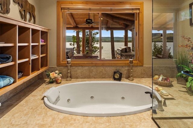 51605 Lake Mary Ronan Rd, Proctor, MT 59929 - full bathroom with a whirlpool tub, ceiling fan, and a water view