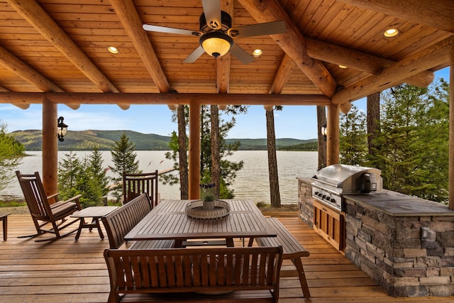 51605 Lake Mary Ronan Rd, Proctor, MT 59929 - wooden terrace featuring area for grilling, a water view, and ceiling fan