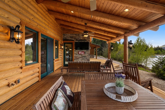 51605 Lake Mary Ronan Rd, Proctor, MT 59929 - wooden terrace with a ceiling fan and outdoor lounge area