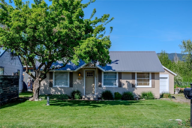 514 W 1st St, Libby, MT 59923 - single story home featuring a front lawn and metal roof