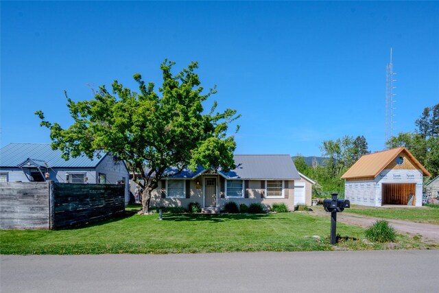 514 W 1st St, Libby, MT 59923 - view of front of home with an outdoor structure and dirt driveway