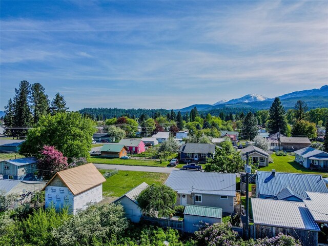 514 W 1st St, Libby, MT 59923 - aerial perspective of suburban area with a mountainous background