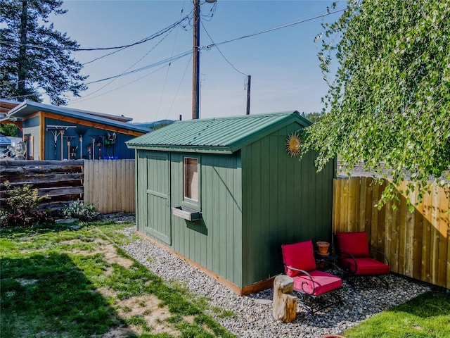 514 W 1st St, Libby, MT 59923 - view of shed with a fenced backyard