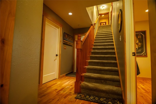 35966 Dublin Gulch Rd, Saint Ignatius, MT 59865 - staircase featuring wood finished floors, recessed lighting, and baseboards
