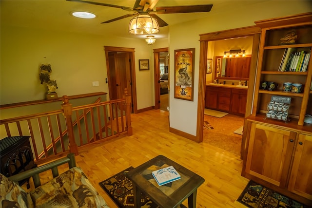 35966 Dublin Gulch Rd, Saint Ignatius, MT 59865 - corridor featuring an upstairs landing, light wood finished floors, baseboards, and recessed lighting