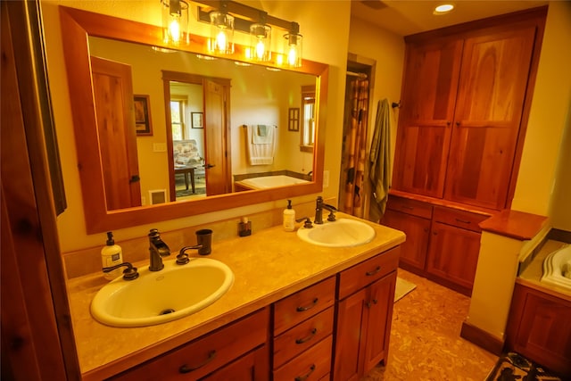 35966 Dublin Gulch Rd, Saint Ignatius, MT 59865 - bathroom with a bathtub, double vanity, and recessed lighting