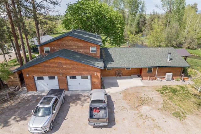 35966 Dublin Gulch Rd, Saint Ignatius, MT 59865 - view of front of house featuring asphalt driveway, a shingled roof, and a garage