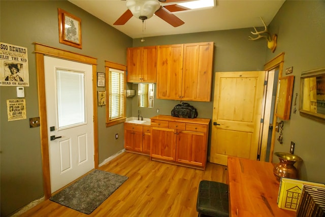 35966 Dublin Gulch Rd, Saint Ignatius, MT 59865 - kitchen featuring a sink, light wood-type flooring, and a ceiling fan