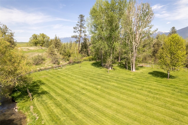 35966 Dublin Gulch Rd, Saint Ignatius, MT 59865 - view of green lawn featuring a mountain view and a view of countryside