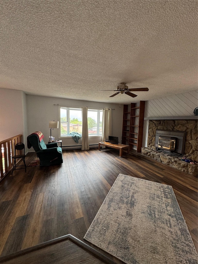4900 Clearview Way, Missoula, MT 59803 - living room with a textured ceiling, ceiling fan, a fireplace, and wood finished floors