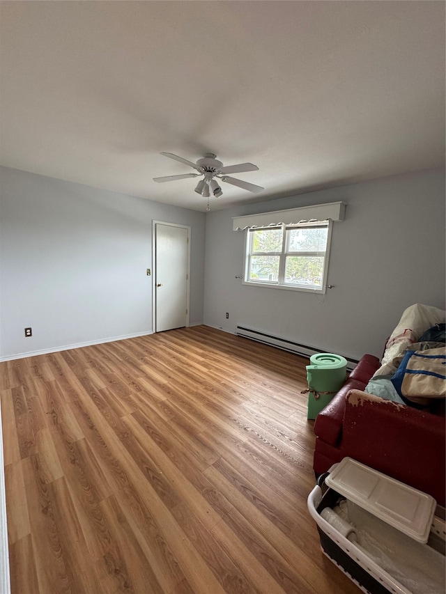 4900 Clearview Way, Missoula, MT 59803 - living area with light wood-style flooring, ceiling fan, and baseboard heating