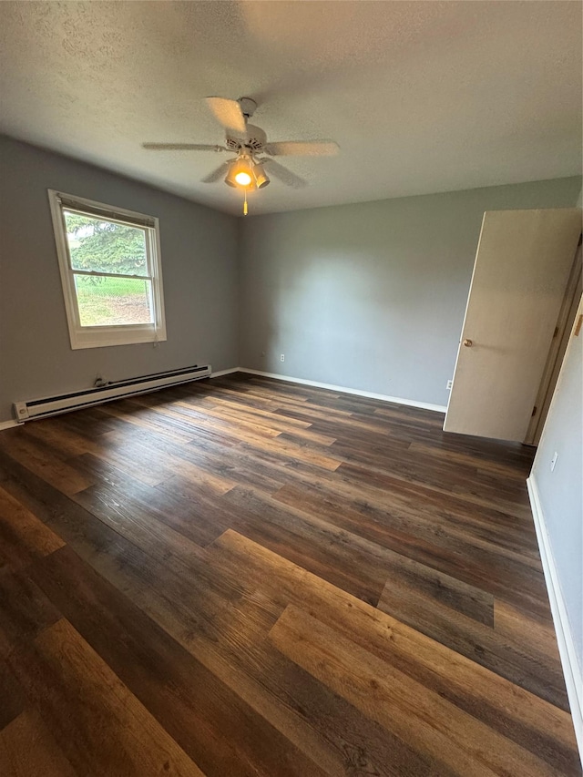 4900 Clearview Way, Missoula, MT 59803 - empty room with baseboard heating, a textured ceiling, a ceiling fan, dark wood-style flooring, and baseboards