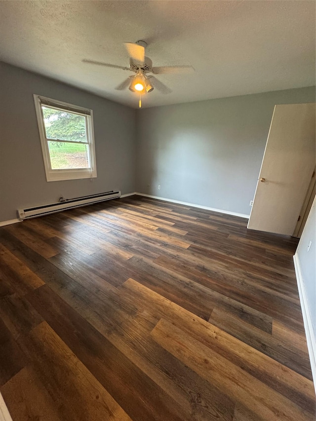 4900 Clearview Way, Missoula, MT 59803 - unfurnished room featuring a baseboard radiator, dark wood-style floors, a ceiling fan, a textured ceiling, and baseboards