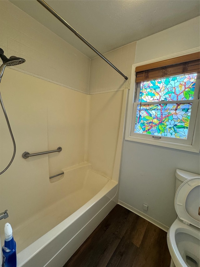4900 Clearview Way, Missoula, MT 59803 - bathroom with wood finished floors, toilet, shower / tub combination, and baseboards