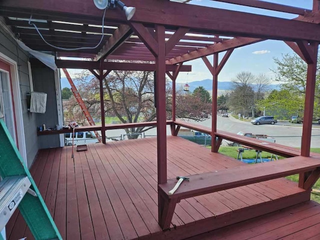 4900 Clearview Way, Missoula, MT 59803 - wooden deck featuring a pergola and a mountain view