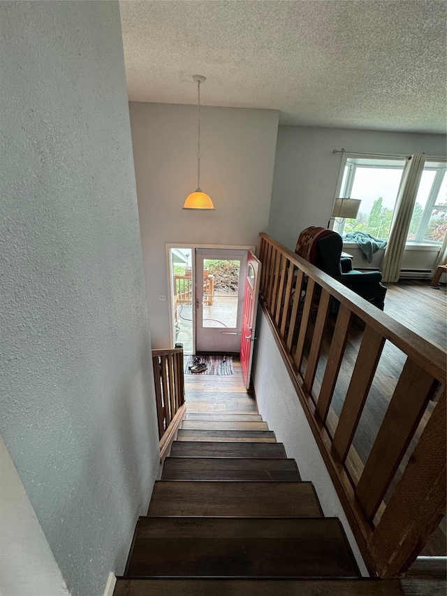 4900 Clearview Way, Missoula, MT 59803 - stairs featuring a textured wall and a textured ceiling