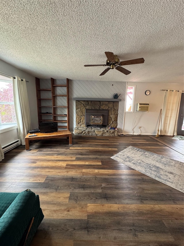 4900 Clearview Way, Missoula, MT 59803 - living area with a fireplace, a textured ceiling, a wall mounted air conditioner, ceiling fan, and a baseboard radiator