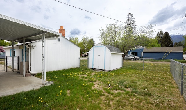 521 Buck St, Stevensville, MT 59870 - view of yard featuring a gate, an outdoor structure, and a shed