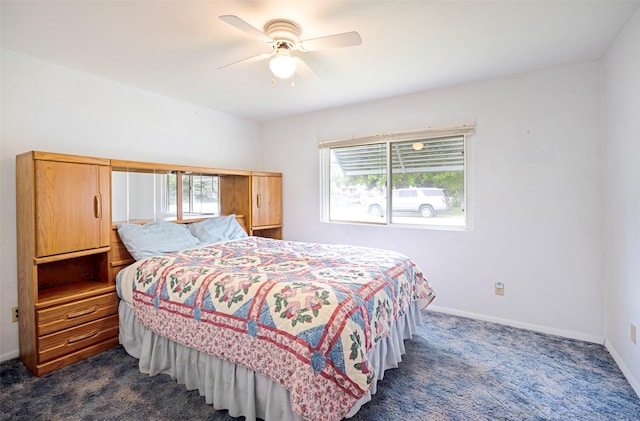 521 Buck St, Stevensville, MT 59870 - bedroom with dark carpet, baseboards, and a ceiling fan
