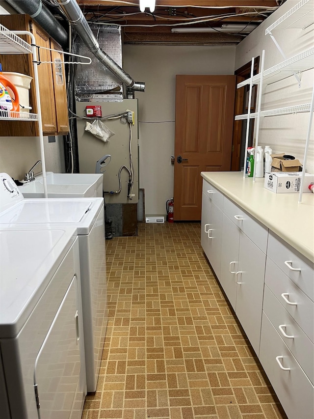 156 Clary Ave W, Geraldine, MT 59446 - laundry room with cabinet space, brick patterned floors, and separate washer and dryer