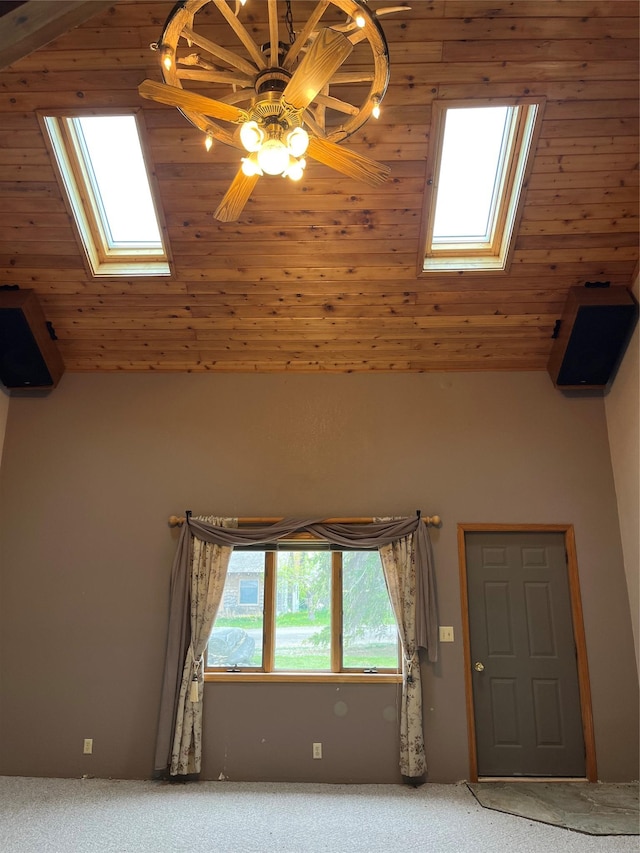 156 Clary Ave W, Geraldine, MT 59446 - interior space featuring a skylight, a ceiling fan, light carpet, and vaulted ceiling
