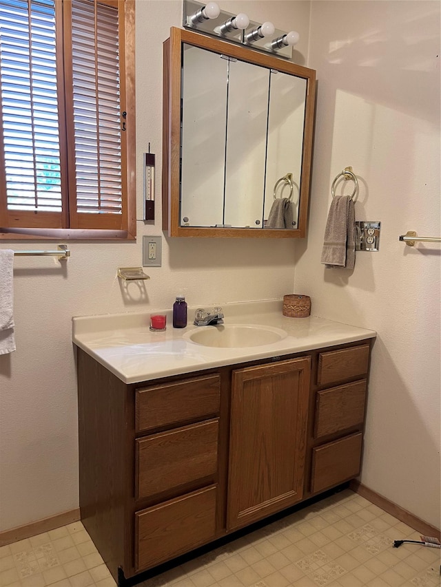 156 Clary Ave W, Geraldine, MT 59446 - bathroom with vanity, baseboards, and tile patterned floors