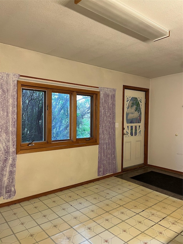 156 Clary Ave W, Geraldine, MT 59446 - entryway featuring a textured ceiling and baseboards