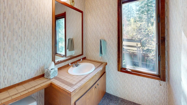 1487 Lion Mountain Dr, Whitefish, MT 59937 - bathroom featuring wallpapered walls and vanity