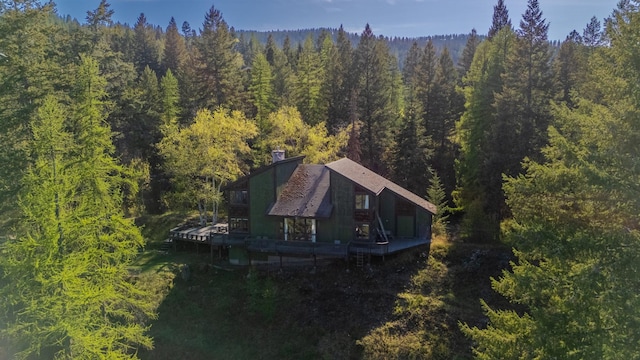1487 Lion Mountain Dr, Whitefish, MT 59937 - aerial view of property and surrounding area featuring a heavily wooded area