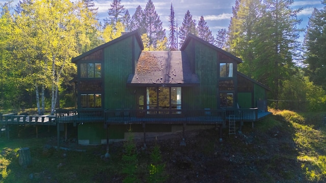 1487 Lion Mountain Dr, Whitefish, MT 59937 - back of house featuring a wooden deck and a forest view