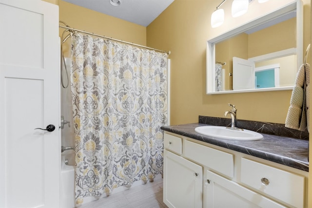 500 Bass Ln, Corvallis, MT 59828 - bathroom featuring vanity and shower / bathtub combination with curtain