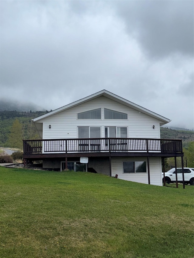 3946 E Ridge Rd, Butte, MT 59701 - back of property with a wooden deck and a lawn