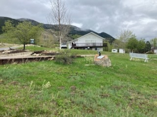 3946 E Ridge Rd, Butte, MT 59701 - view of green lawn with a mountain view