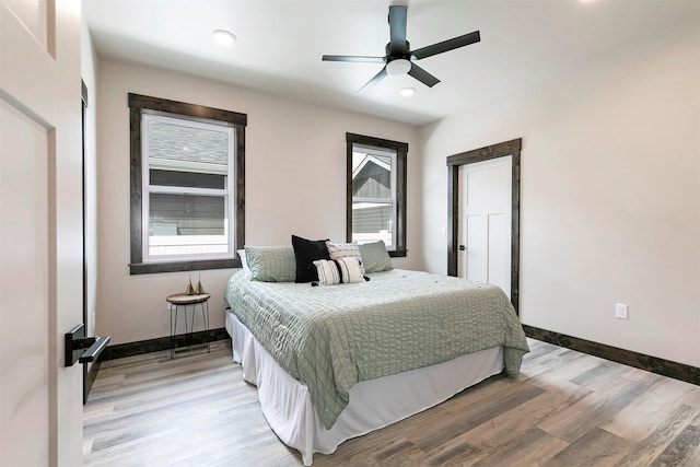 5576 Cattle Dr, Missoula, MT 59808 - bedroom with baseboards, light wood finished floors, recessed lighting, and a ceiling fan
