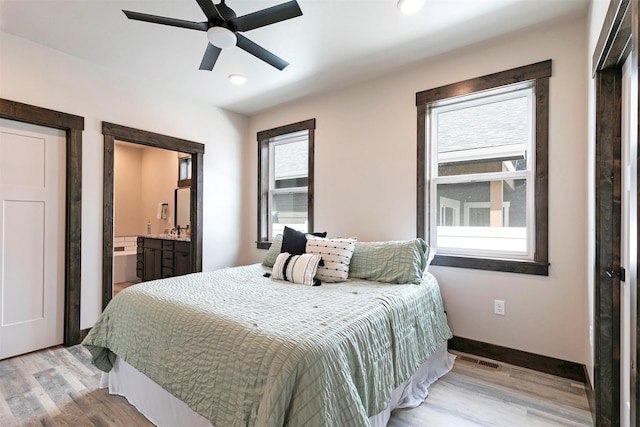 5576 Cattle Dr, Missoula, MT 59808 - bedroom featuring light wood-style flooring, recessed lighting, baseboards, ensuite bathroom, and ceiling fan