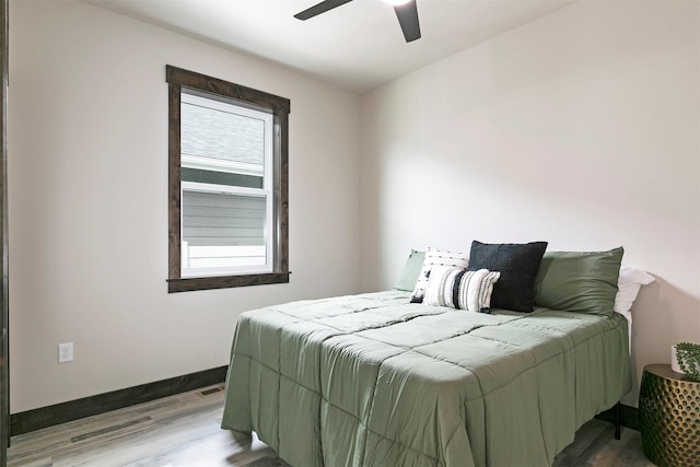 5576 Cattle Dr, Missoula, MT 59808 - bedroom featuring wood finished floors, baseboards, and ceiling fan