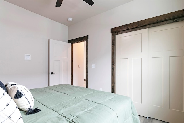 5576 Cattle Dr, Missoula, MT 59808 - bedroom with light wood finished floors, a closet, and a ceiling fan