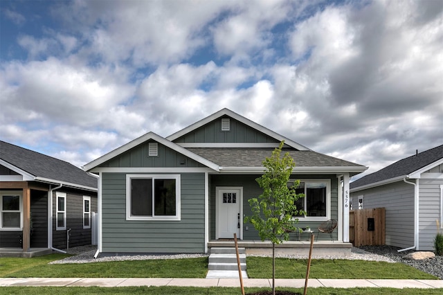 5576 Cattle Dr, Missoula, MT 59808 - view of front of house featuring board and batten siding and a shingled roof