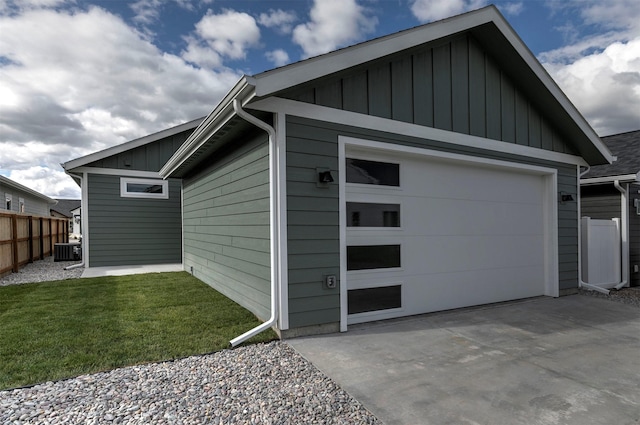 5576 Cattle Dr, Missoula, MT 59808 - garage with central air condition unit and concrete driveway