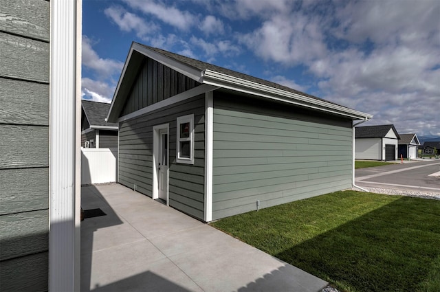 5576 Cattle Dr, Missoula, MT 59808 - view of property exterior with a lawn and a patio