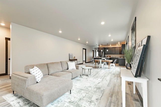5576 Cattle Dr, Missoula, MT 59808 - living room featuring light wood-style floors, recessed lighting, and baseboards