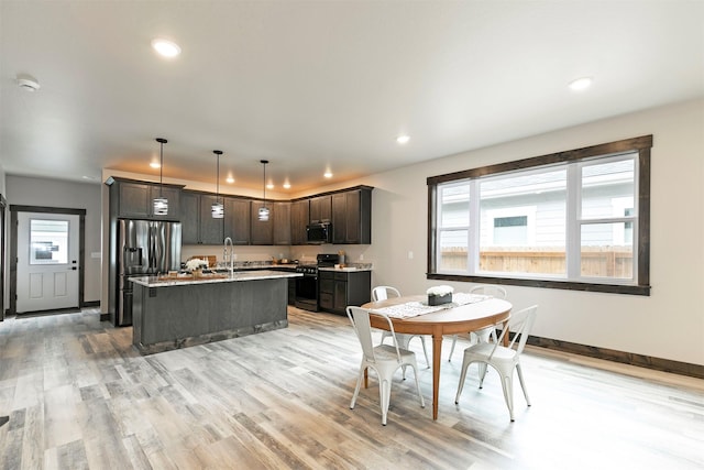 5576 Cattle Dr, Missoula, MT 59808 - dining room featuring recessed lighting, light wood-type flooring, and baseboards