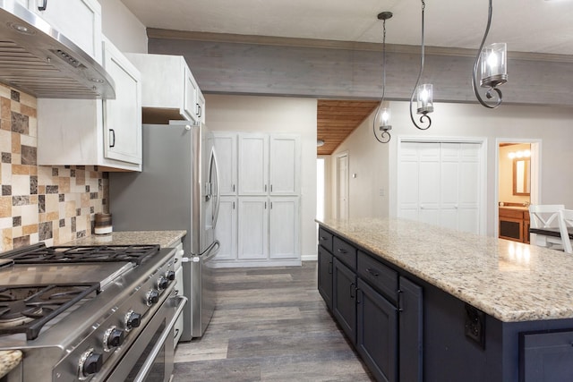 6400 Boondock Ln, Clinton, MT 59825 - kitchen featuring stainless steel range, exhaust hood, tasteful backsplash, dark wood-style floors, and white cabinetry